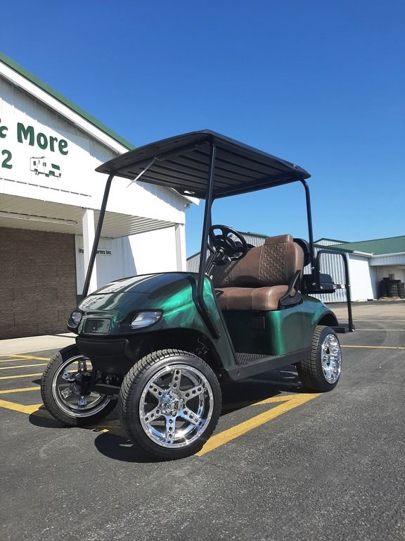 A green 2020 Club Car® Onward® 2 Passenger Electric golf cart.